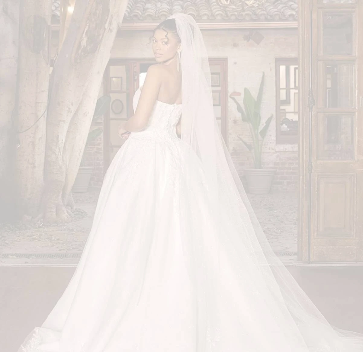 Model Wearing a bridal gown by Essense of Australia