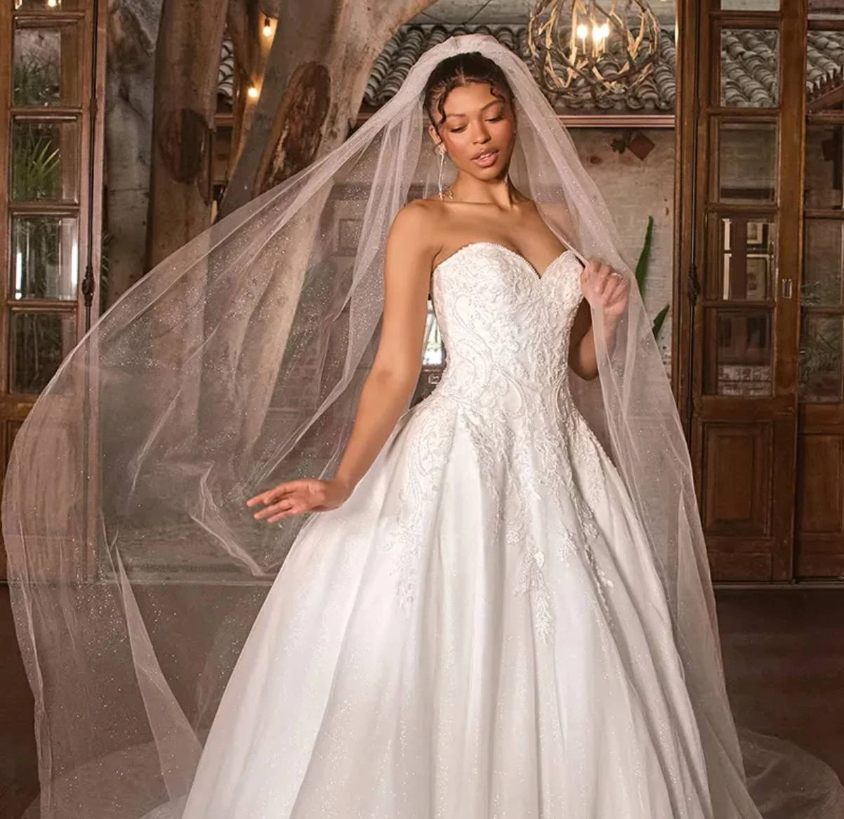 Model Wearing a bridal gown by Essense of Australia